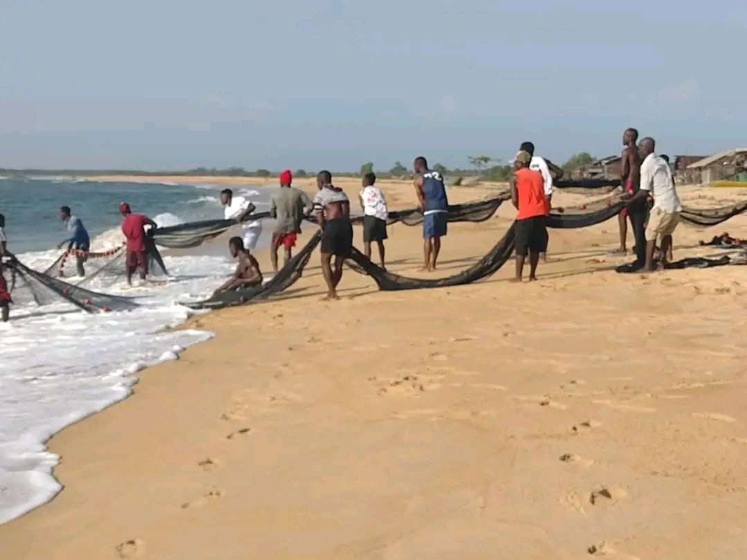 Fishermen casting nets on the river