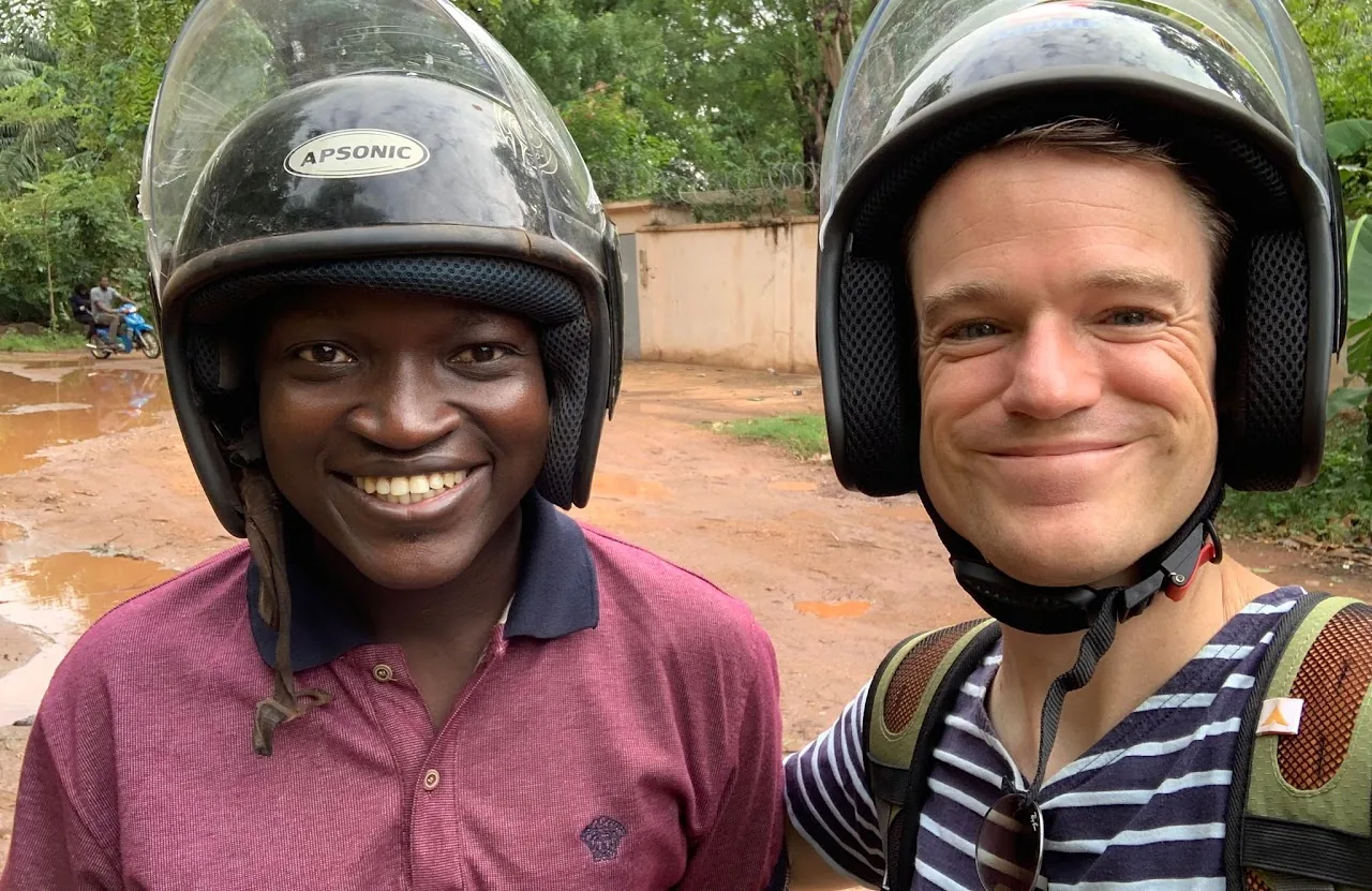 Travellers with local guide in West Africa